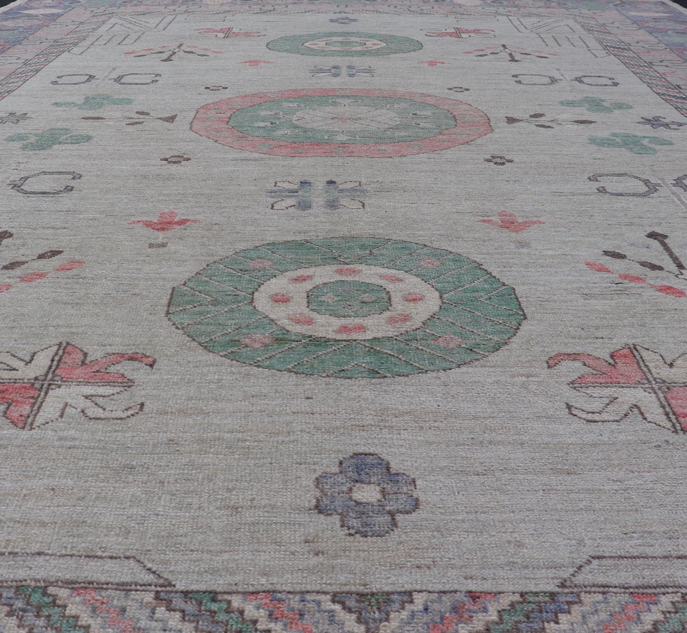 Finely hand knotted Khotan Rug with Circular Medallions in Shades of Purple, light Green, salmon, medium green and Cream. Keivan Woven Arts / rug AFG - 67298, country of origin / type: Afghanistan / Khotan. Measures: 9'8 x 13' This modern... - Keivan Woven ArtsAFG - 67298 - 24547Rugs