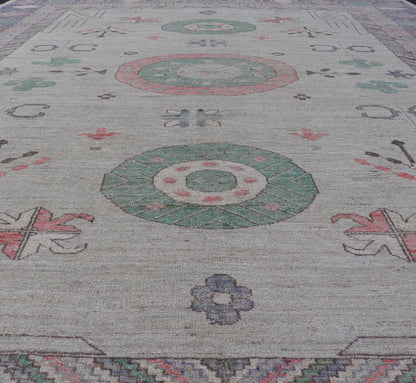 Finely hand knotted Khotan Rug with Circular Medallions in Shades of Purple, light Green, salmon, medium green and Cream. Keivan Woven Arts / rug AFG - 67298, country of origin / type: Afghanistan / Khotan. Measures: 9'8 x 13' This modern... - Keivan Woven ArtsAFG - 67298 - 24547Rugs