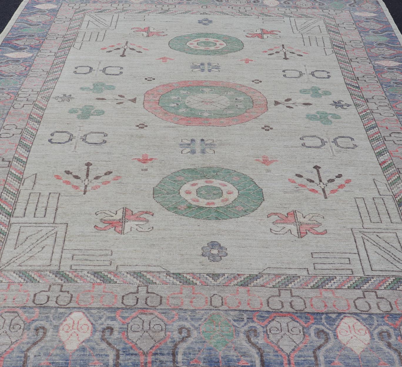 Finely hand knotted Khotan Rug with Circular Medallions in Shades of Purple, light Green, salmon, medium green and Cream. Keivan Woven Arts / rug AFG - 67298, country of origin / type: Afghanistan / Khotan. Measures: 9'8 x 13' This modern... - Keivan Woven ArtsAFG - 67298 - 24547Rugs