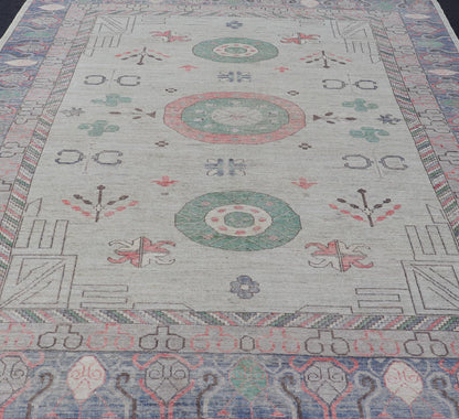 Finely hand knotted Khotan Rug with Circular Medallions in Shades of Purple, light Green, salmon, medium green and Cream. Keivan Woven Arts / rug AFG - 67298, country of origin / type: Afghanistan / Khotan. Measures: 9'8 x 13' This modern... - Keivan Woven ArtsAFG - 67298 - 24547Rugs