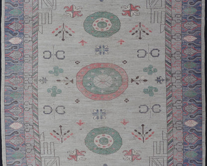 Finely hand knotted Khotan Rug with Circular Medallions in Shades of Purple, light Green, salmon, medium green and Cream. Keivan Woven Arts / rug AFG - 67298, country of origin / type: Afghanistan / Khotan. Measures: 9'8 x 13' This modern... - Keivan Woven ArtsAFG - 67298 - 24547Rugs
