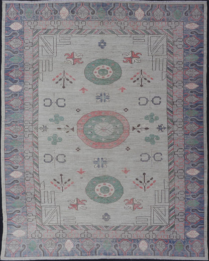 Finely hand knotted Khotan Rug with Circular Medallions in Shades of Purple, light Green, salmon, medium green and Cream. Keivan Woven Arts / rug AFG - 67298, country of origin / type: Afghanistan / Khotan. Measures: 9'8 x 13' This modern... - Keivan Woven ArtsAFG - 67298 - 24547Rugs