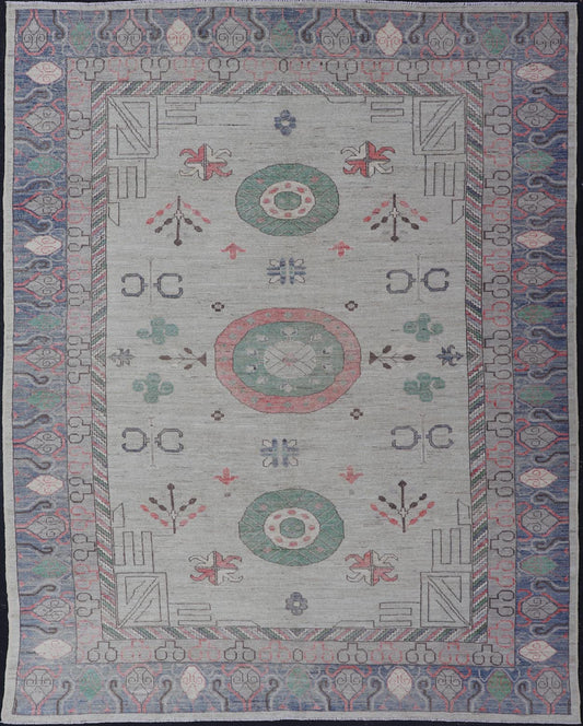 Finely hand knotted Khotan Rug with Circular Medallions in Shades of Purple, light Green, salmon, medium green and Cream. Keivan Woven Arts / rug AFG - 67298, country of origin / type: Afghanistan / Khotan. Measures: 9'8 x 13' This modern... - Keivan Woven ArtsAFG - 67298 - 24547Rugs