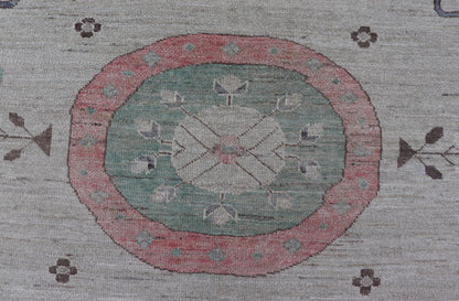 Finely hand knotted Khotan Rug with Circular Medallions in Shades of Purple, light Green, salmon, medium green and Cream. Keivan Woven Arts / rug AFG - 67298, country of origin / type: Afghanistan / Khotan. Measures: 9'8 x 13' This modern... - Keivan Woven ArtsAFG - 67298 - 24547Rugs