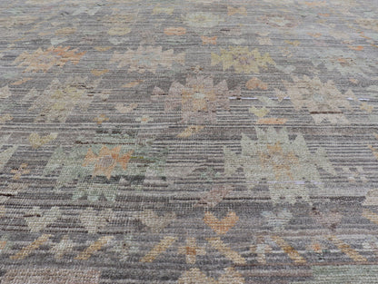 Modern Afghan Tribal Motif Designed Rug in Muted Tones and A Gray Background Measures 7'2 x 8'4 This modern area rug was hand - knotted in Afghanistan during the 2020's. This modern rug does feature a border of modest floral motifs. The gr... - Keivan Woven ArtsAFGC - 39487 - 18565Rug
