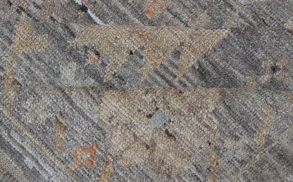 Modern Afghan Tribal Motif Designed Rug in Muted Tones and A Gray Background Measures 7'2 x 8'4 This modern area rug was hand - knotted in Afghanistan during the 2020's. This modern rug does feature a border of modest floral motifs. The gr... - Keivan Woven ArtsAFGC - 39487 - 18565Rug