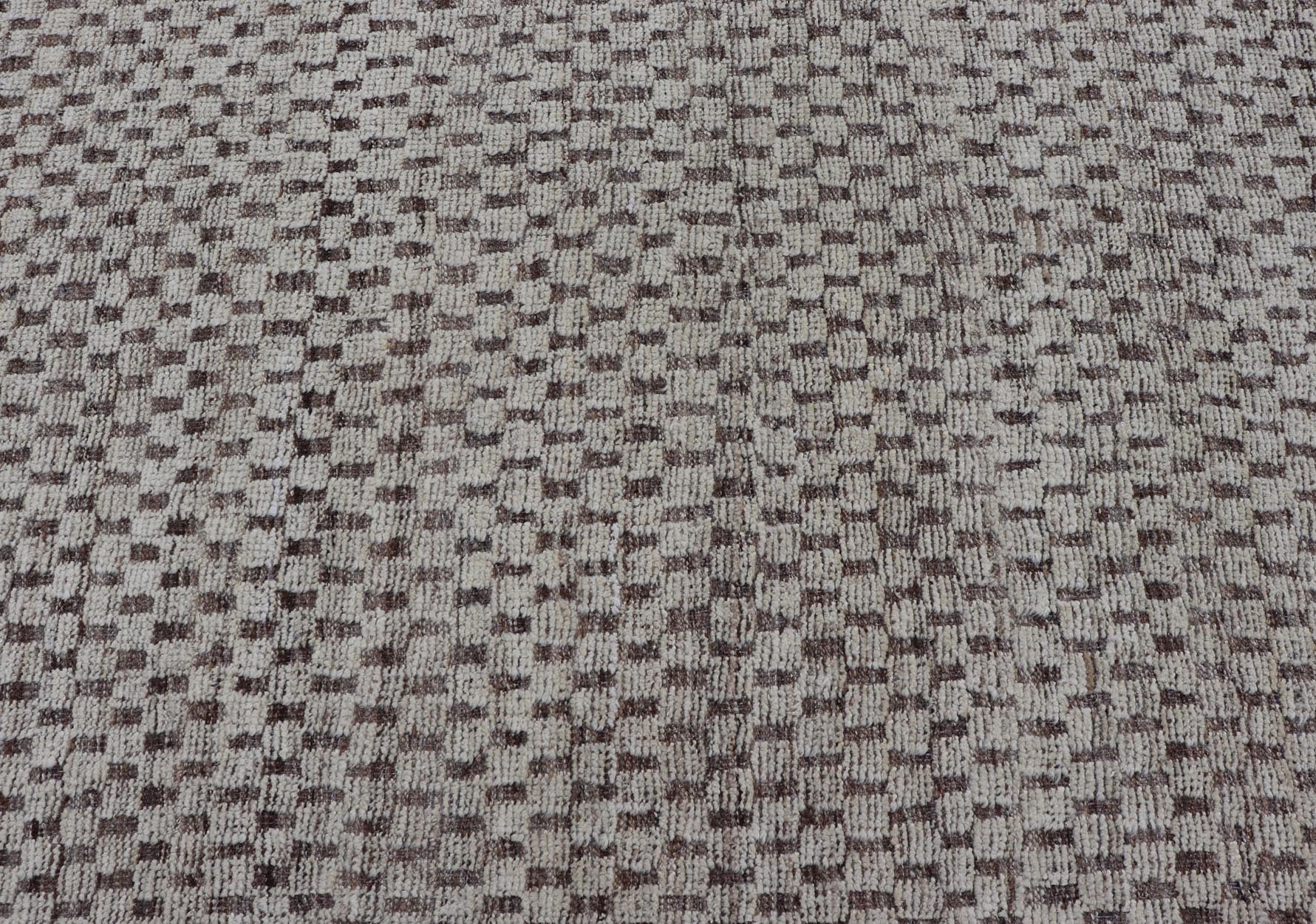 Modern Hand - Knotted Rug in Wool with All - Over Geometric Checkerboard Design This modern casual tribal rug has been hand - knotted. The rug features a modern all - over geometric checkerboard - like design, rendered in brown, cream, taupe, and gray ton... - Keivan Woven ArtsAFGC - 39754 - 19520Rug