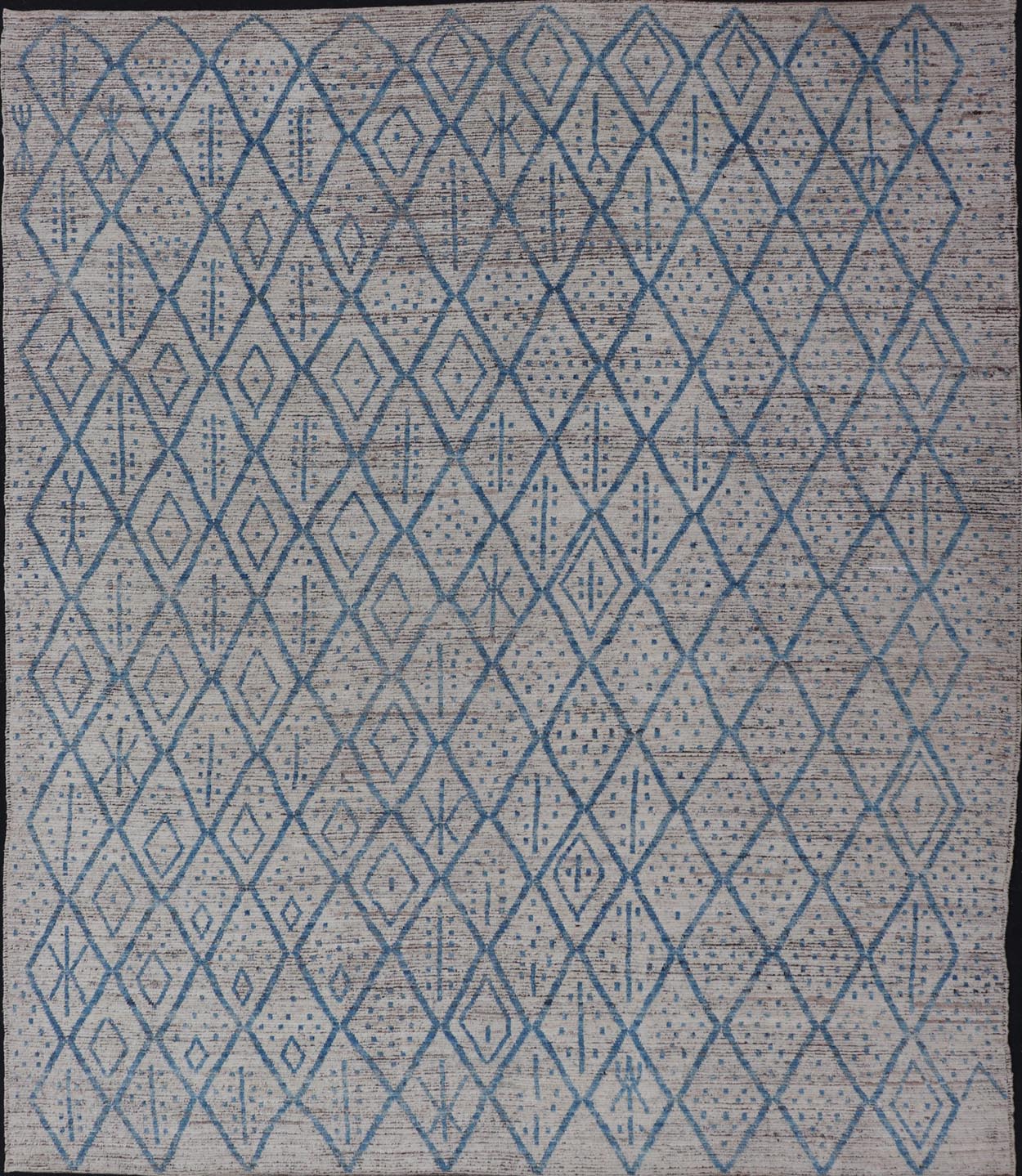 Modern Hand - Knotted Tribal Rug in Wool with Sub - Geometric Design in Blue & Ivory This modern casual tribal rug has been hand - knotted. The rug features a modern sub - geometric diamond design, replete with various motifs, rendered in blue and ivor... - Keivan Woven ArtsAFGC - 40822 - 19418Rug