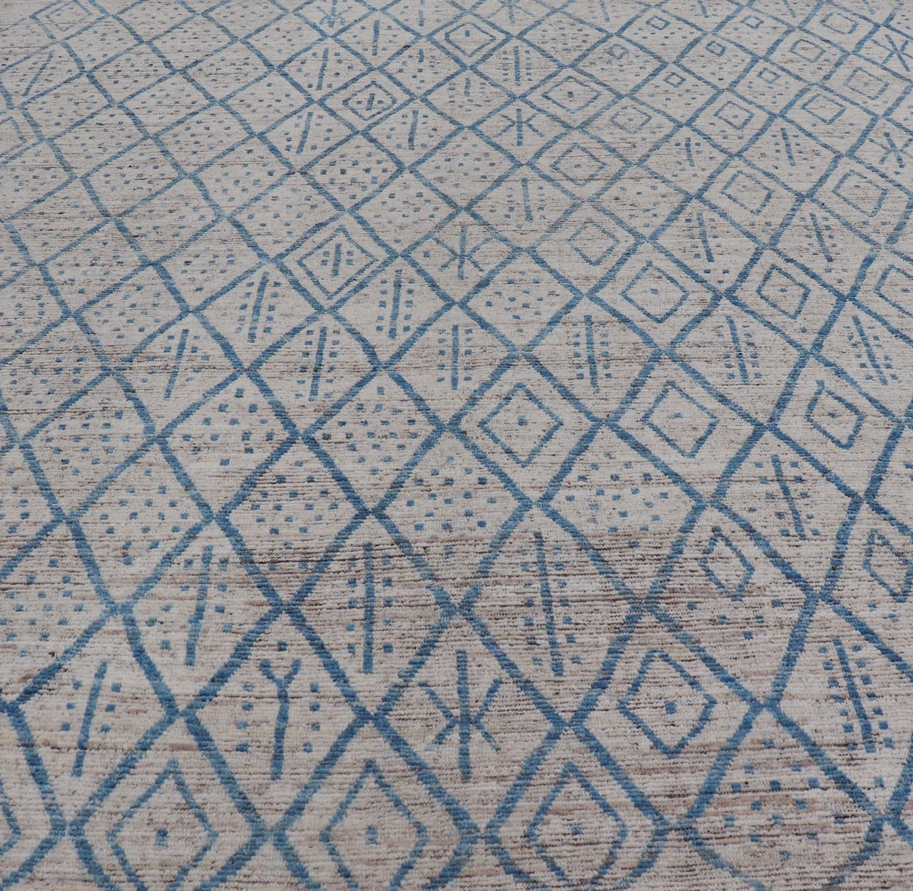 Modern Hand - Knotted Tribal Rug in Wool with Sub - Geometric Design in Blue & Ivory This modern casual tribal rug has been hand - knotted. The rug features a modern sub - geometric diamond design, replete with various motifs, rendered in blue and ivor... - Keivan Woven ArtsAFGC - 40822 - 19418Rug