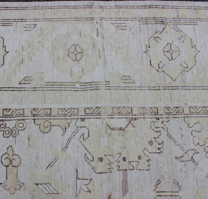 This Afghan made fine rug rug features a transitional design of stylized motifs in the central field, which are flanked by a repeating pattern in the border. The entirety of the piece is rendered in light tones, which makes it a versatile rug, well - sui... - Keivan Woven ArtsAIA - 151 - 6422Rug