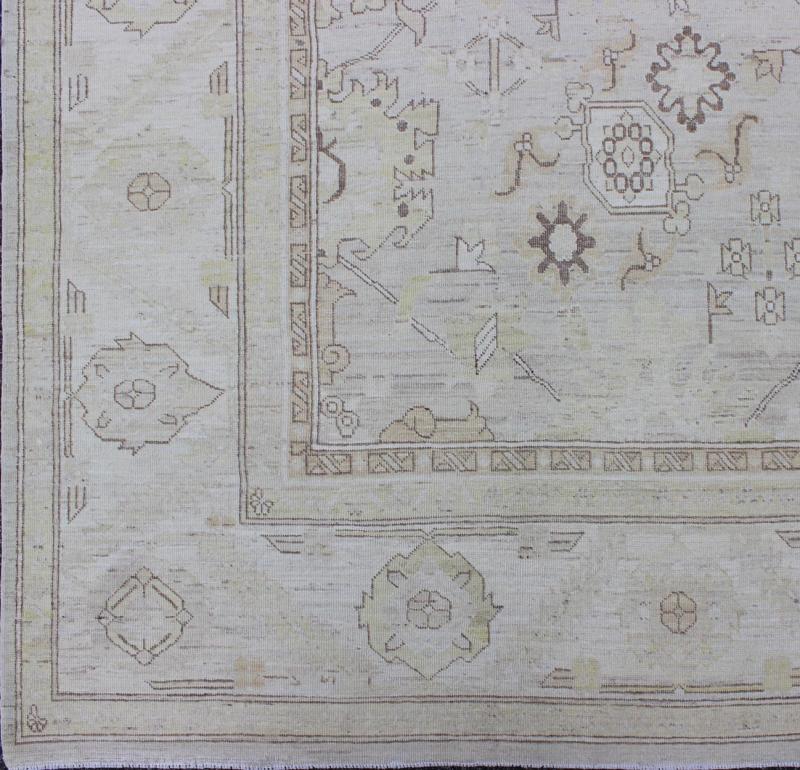 This Afghan made fine rug rug features a transitional design of stylized motifs in the central field, which are flanked by a repeating pattern in the border. The entirety of the piece is rendered in light tones, which makes it a versatile rug, well - sui... - Keivan Woven ArtsAIA - 151 - 6422Rug