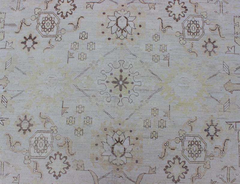 This Afghan made fine rug rug features a transitional design of stylized motifs in the central field, which are flanked by a repeating pattern in the border. The entirety of the piece is rendered in light tones, which makes it a versatile rug, well - sui... - Keivan Woven ArtsAIA - 151 - 6422Rug