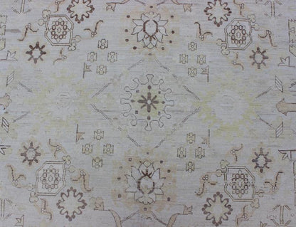 This Afghan made fine rug rug features a transitional design of stylized motifs in the central field, which are flanked by a repeating pattern in the border. The entirety of the piece is rendered in light tones, which makes it a versatile rug, well - sui... - Keivan Woven ArtsAIA - 151 - 6422Rug