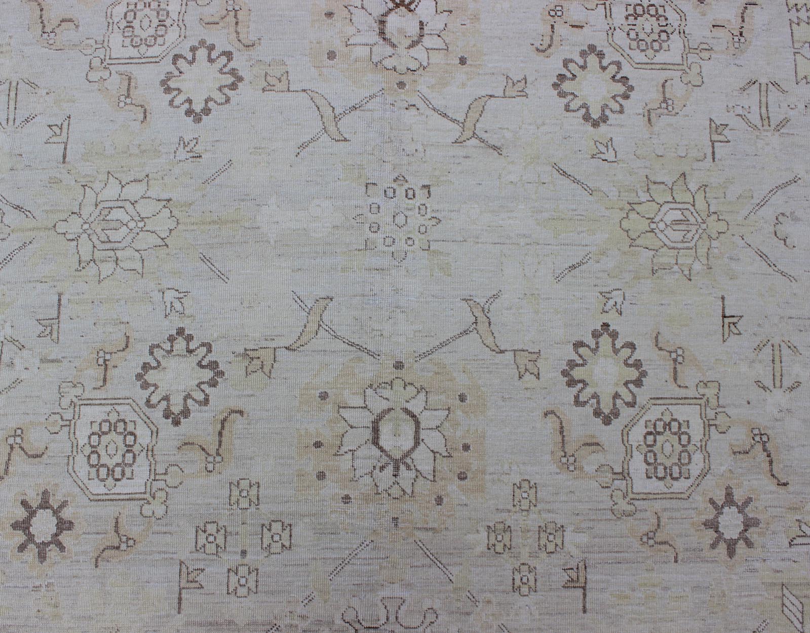 This Afghan made fine rug rug features a transitional design of stylized motifs in the central field, which are flanked by a repeating pattern in the border. The entirety of the piece is rendered in light tones, which makes it a versatile rug, well - sui... - Keivan Woven ArtsAIA - 151 - 6422Rug