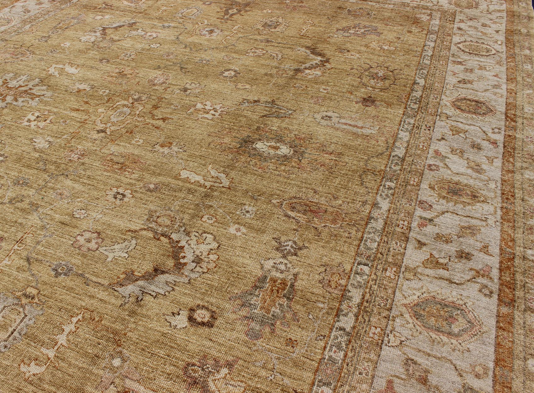 Large Angora Oushak Turkish Rug in Warm Colors of Taupe, Soft Gold, Brown, Cream. This beautiful taupe/gold color Oushak is made with a combination of angora wool and old wool. Featuring all organic materials, the Angora Collection is a modern - d... - Keivan Woven ArtsAN - 104988 - 6568Rug
