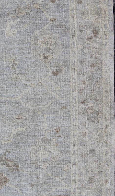 Angora Oushak Turkish Gallery Rug in Shades of Light Blue, Silver and Taupe. From our Angora collection, this piece is made with a combination of angora and old wool. Featuring all organic materials, the Angora collection is a modern - day remake of ... - Keivan Woven ArtsAN - 123329 - 6600Rug