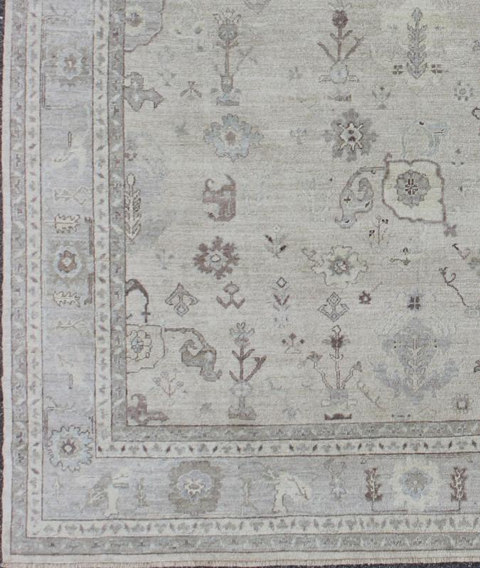 Large Turkish Oushak Rug with Floral Bouquet Motifs in Gray, Taupe & Lavender: Made with a combination of angora and old wool, this magnificent vintage Turkish Oushak boasts an all - over design in a large - scale style. The plentiful floral and bouquet mo... - Keivan Woven ArtsAN - 123660 - 7028Rug