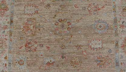Turkish Oushak Floral Design with Color on A Taupe Field and Ivory Border This hand - knotted Oushak has a sub - floral Oushak design that spreads on the the field, rendered in coral, salmon, light blue, gold, and green. The background of the field... - Keivan Woven ArtsAN - 149322 - 19923Rug