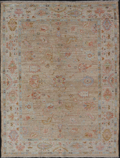 Turkish Oushak Floral Design with Color on A Taupe Field and Ivory Border This hand - knotted Oushak has a sub - floral Oushak design that spreads on the the field, rendered in coral, salmon, light blue, gold, and green. The background of the field... - Keivan Woven ArtsAN - 149322 - 19923Rug