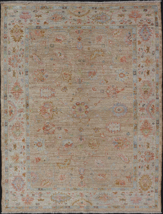 Turkish Oushak Floral Design with Color on A Taupe Field and Ivory Border This hand - knotted Oushak has a sub - floral Oushak design that spreads on the the field, rendered in coral, salmon, light blue, gold, and green. The background of the field... - Keivan Woven ArtsAN - 149322 - 19923Rug
