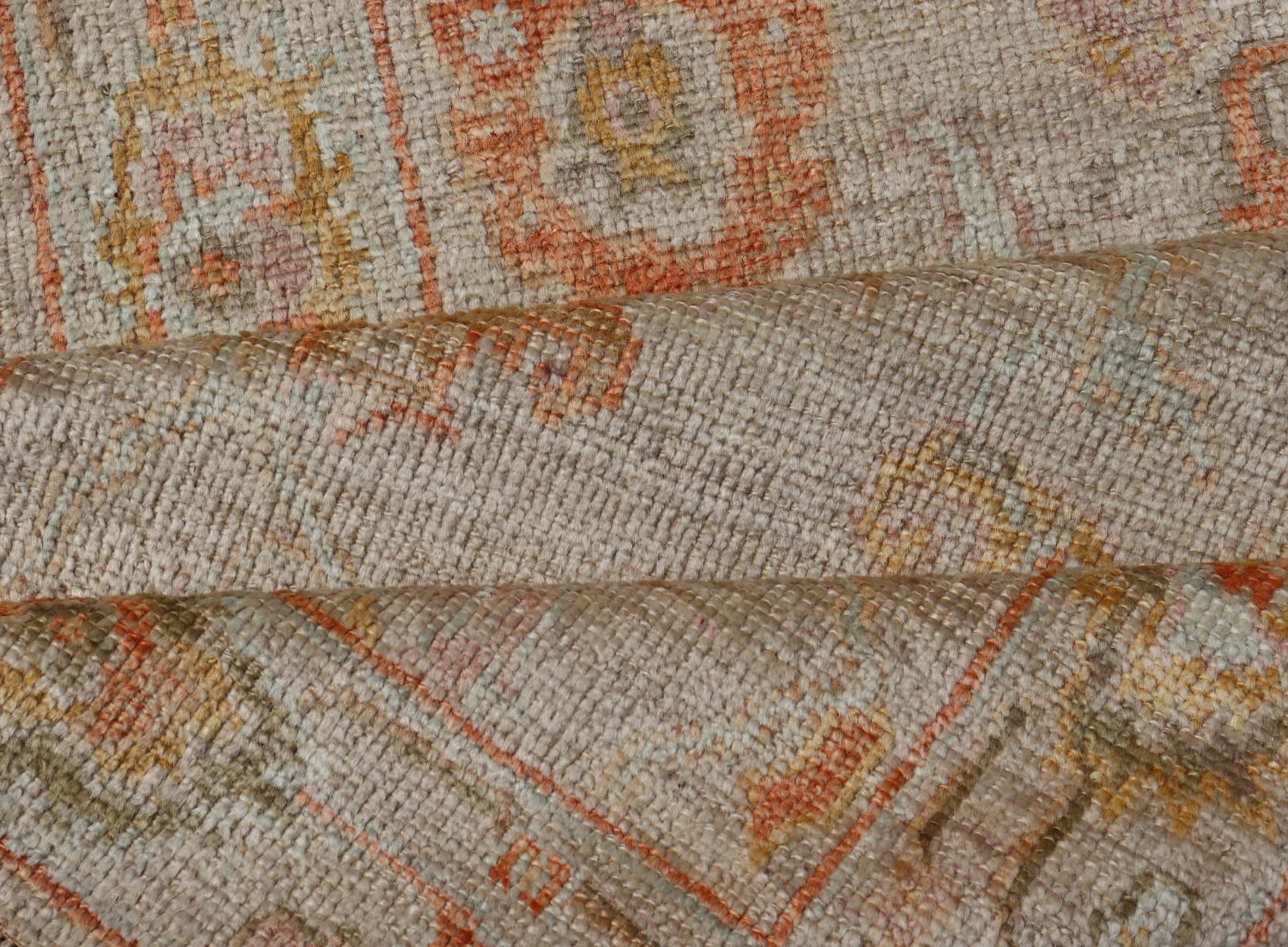 Angora Turkish Oushak Floral Runner in Cream with Pops of Orange, Green and Blue This angora Oushak is unique with is creamy background, to the floral like design rendered in coral, tangerine, forest green, salmon, and hints of sky blue. The bor... - Keivan Woven ArtsAN - 149531 - 19947Rug