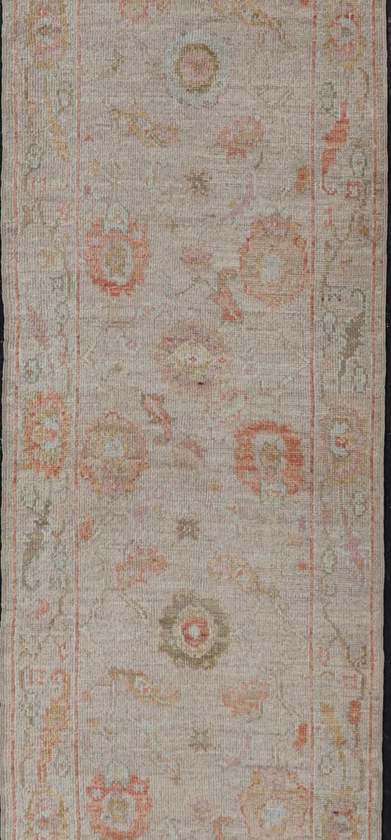 Angora Turkish Oushak Floral Runner in Cream with Pops of Orange, Green and Blue This angora Oushak is unique with is creamy background, to the floral like design rendered in coral, tangerine, forest green, salmon, and hints of sky blue. The bor... - Keivan Woven ArtsAN - 149531 - 19947Rug