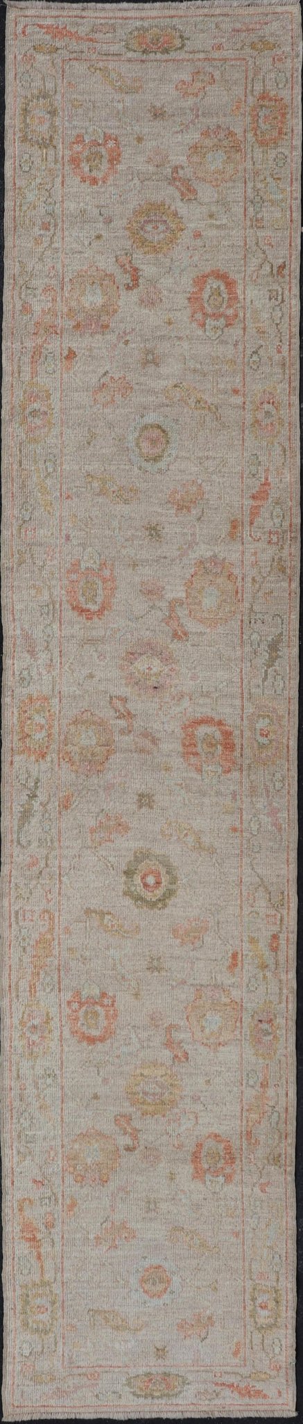 Angora Turkish Oushak Floral Runner in Cream with Pops of Orange, Green and Blue This angora Oushak is unique with is creamy background, to the floral like design rendered in coral, tangerine, forest green, salmon, and hints of sky blue. The bor... - Keivan Woven ArtsAN - 149531 - 19947