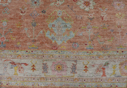 Vibrant Floral Medley on Salmon Pink Hand - Knotted Rug by Keivan Woven Arts. rug / AN - 149682, Turkish 21st Century. Measures: 10'0 x 12'11 The rug showcase's a beautifully woven rug with a vibrant and colorful design on a warm salmon pink backgro... - Keivan Woven ArtsAN - 149682 - 16412Rug