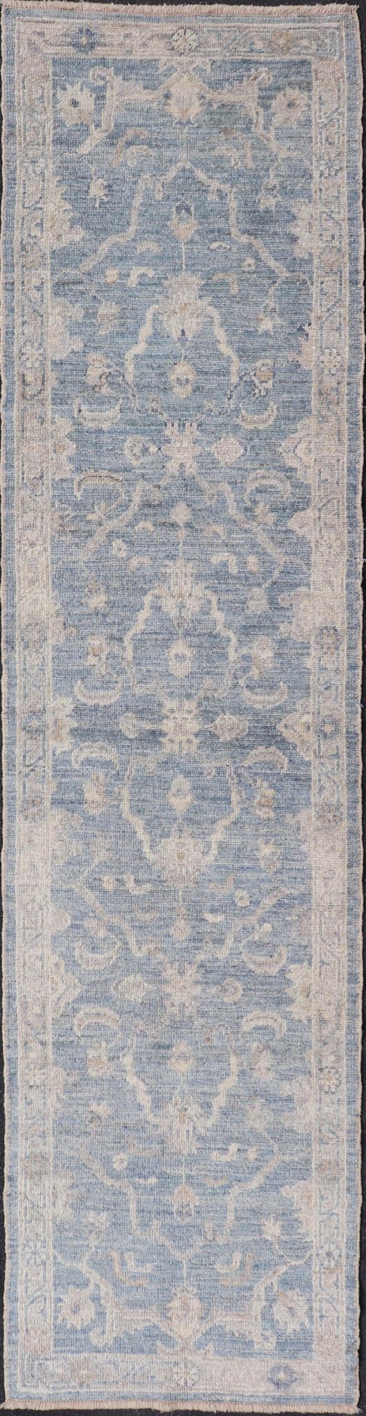 Angora Turkish Oushak Runner with Floral Design and Medium Blue and Gray Border This Oushak Runner is rendered in a medium blue background and a light gray border. The design is an arabesque - like floral pattern, cased within a banded sub - floral ... - Keivan Woven ArtsAN - 149801 - 19935Rug