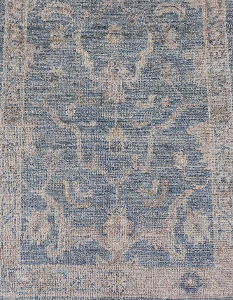 Angora Turkish Oushak Runner with Floral Design and Medium Blue and Gray Border This Oushak Runner is rendered in a medium blue background and a light gray border. The design is an arabesque - like floral pattern, cased within a banded sub - floral ... - Keivan Woven ArtsAN - 149801 - 19935Rug