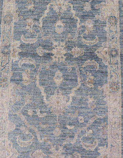Angora Turkish Oushak Runner with Floral Design and Medium Blue and Gray Border This Oushak Runner is rendered in a medium blue background and a light gray border. The design is an arabesque - like floral pattern, cased within a banded sub - floral ... - Keivan Woven ArtsAN - 149801 - 19935Rug
