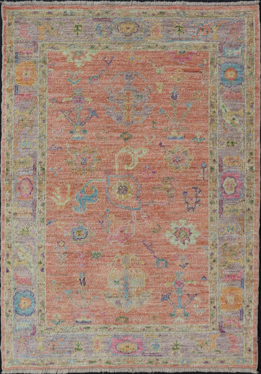 Hand Knotted Turkish Floral Oushak with Orange Background and Lilac Border This very unique piece has a wide array of bright colors, starting with a faded orange background and a light lilac border, showcasing fuchsia, electric blue, violet, or... - Keivan Woven ArtsAN - 149896 - 19941Rug