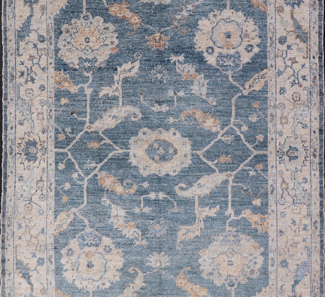 Angora Turkish Oushak Floral Design in Blue, Creams and Mocha Colors This angora Oushak has a unique floral design on top of a faded blue background with a slight cream and mocha undertone. Keivan Woven Arts rug AN - 150778 Measures; 6... - Keivan Woven ArtsAN - 150778 - 19953Rug