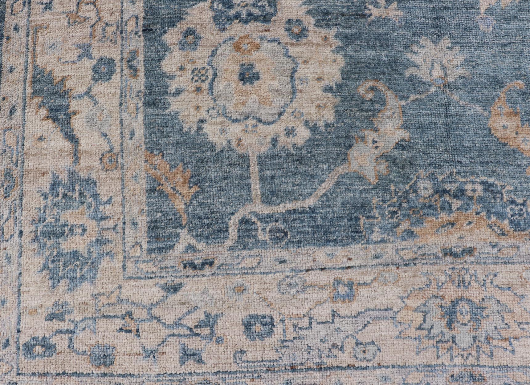 Angora Turkish Oushak Floral Design in Blue, Creams and Mocha Colors This angora Oushak has a unique floral design on top of a faded blue background with a slight cream and mocha undertone. Keivan Woven Arts rug AN - 150778 Measures; 6... - Keivan Woven ArtsAN - 150778 - 19953Rug