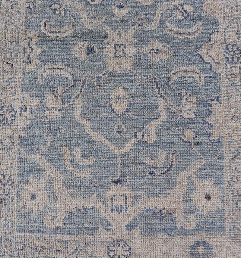 This Oushak Runner is rendered in a medium blue background and a light gray border. The design is an arabesque - like floral pattern, cased within a banded sub - floral border in light gray. Measures: 2'7 x 11'8 Angora Turkish Oushak Runner wit... - Keivan Woven ArtsAN - 151167 - 21391Rug