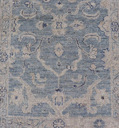 This Oushak Runner is rendered in a medium blue background and a light gray border. The design is an arabesque - like floral pattern, cased within a banded sub - floral border in light gray. Measures: 2'7 x 11'8 Angora Turkish Oushak Runner wit... - Keivan Woven ArtsAN - 151167 - 21391Rug