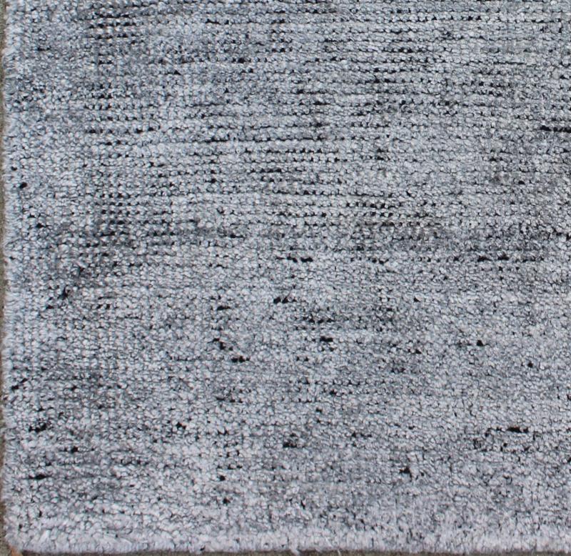 Color A A monochromatic composition emphasizes the streamlined design of this contemporary rug, the sheered down pile evokes a minimalist textured aesthetic. Faint pops of color shine against a solid field in this one - of - a - kind rug, each rug is org... - Keivan Woven ArtsAPE - 1 - MAR - A - 6484Rug