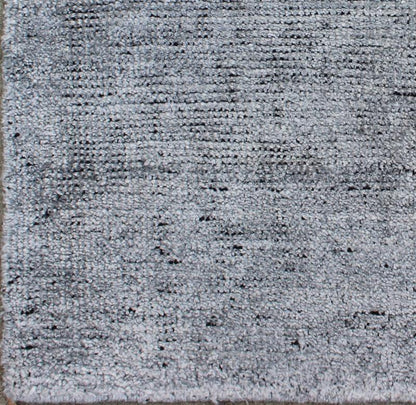 Color A A monochromatic composition emphasizes the streamlined design of this contemporary rug, the sheered down pile evokes a minimalist textured aesthetic. Faint pops of color shine against a solid field in this one - of - a - kind rug, each rug is org... - Keivan Woven ArtsAPE - 1 - MAR - A - 6484Rug