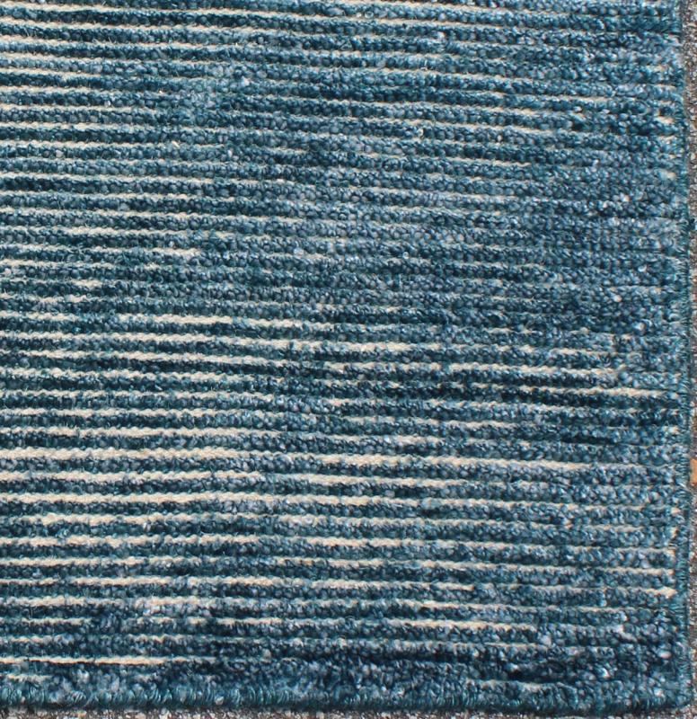 COLOR - L A monochromatic composition emphasizes the streamlined design of this contemporary rug, the sheered down pile evokes a minimalist textured aesthetic. Faint pops of color shine against a solid field in this one - of - a - kind rug, each rug is organic... - Keivan Woven ArtsAPE - 42 - MAR - L - 6584Rug