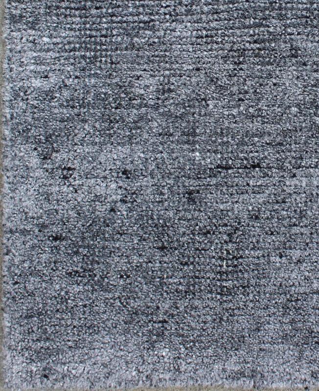 Color N A monochromatic composition emphasizes the streamlined design of this contemporary rug, the sheered down pile evokes a minimalist textured aesthetic. Faint pops of color shine against a solid field in this one - of - a - kind rug, each rug is organic... - Keivan Woven ArtsAPE - 7 - MAR - N - 6494Rug