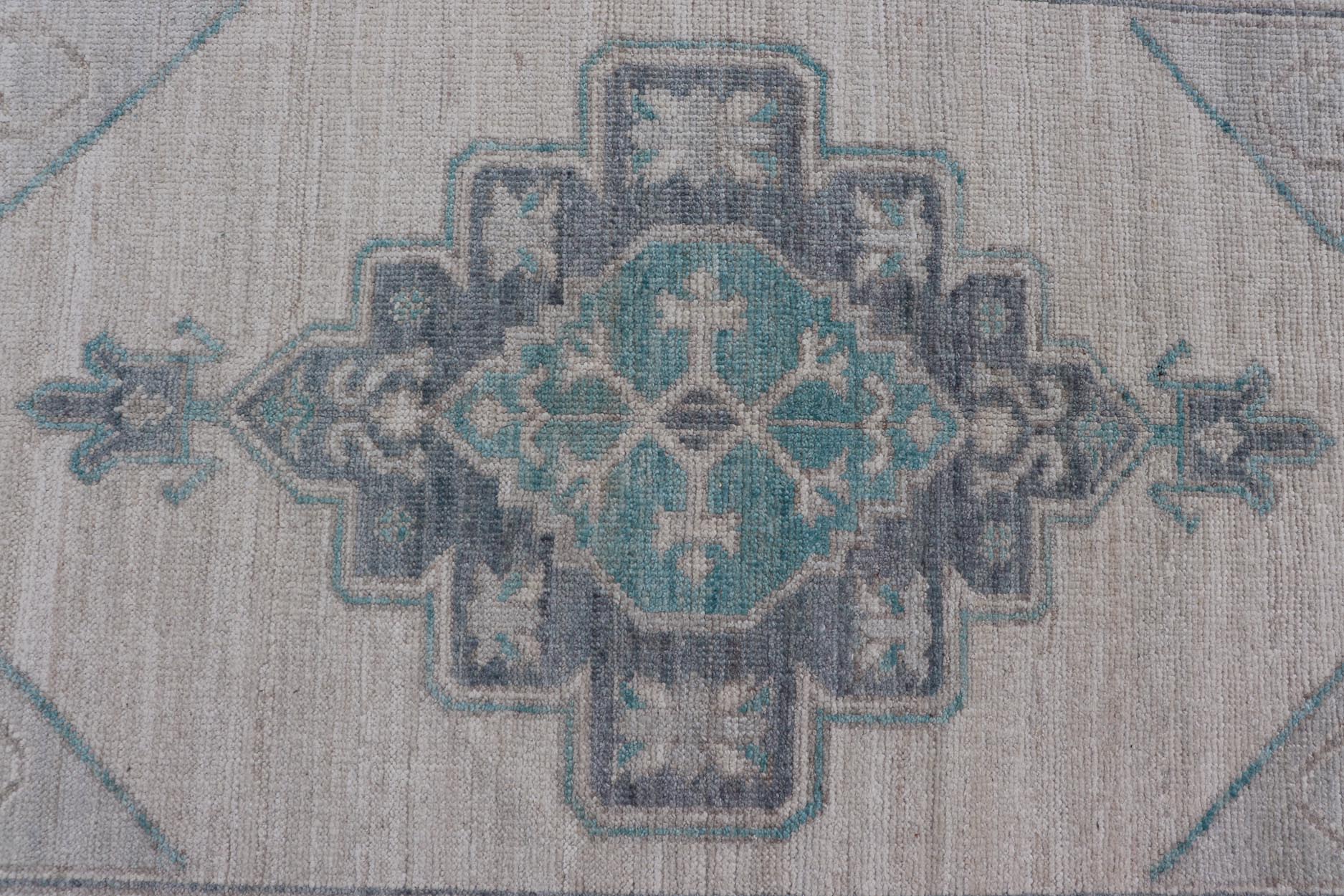 Modern Oushak with Off White Background with A Large Tribal Medallion in Teal. Measures: 3'1 x 5'3 This Oushak featuring a center tribal medallion in the center of off white background and the light gray border also. Colors are gray, cre... - Keivan Woven ArtsAWR - 10719 - 21541Rug