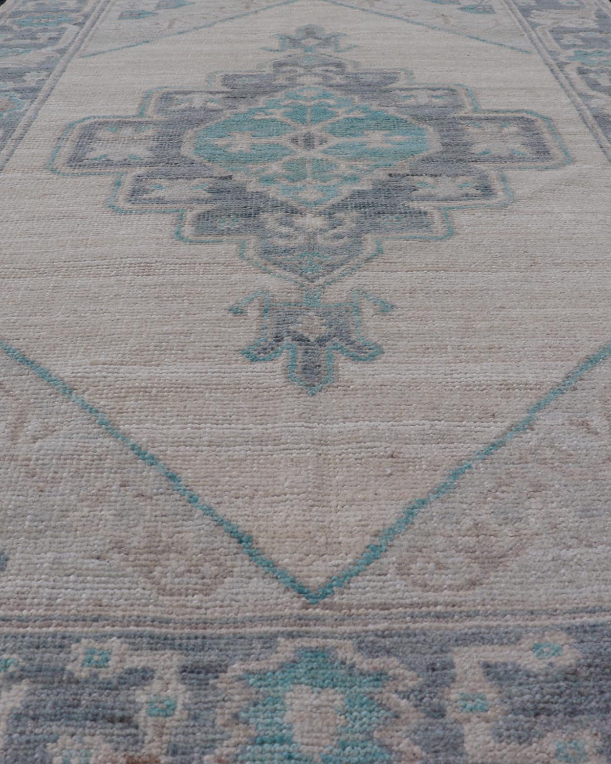 Modern Oushak with Off White Background with A Large Tribal Medallion in Teal. Measures: 3'1 x 5'3 This Oushak featuring a center tribal medallion in the center of off white background and the light gray border also. Colors are gray, cre... - Keivan Woven ArtsAWR - 10719 - 21541Rug
