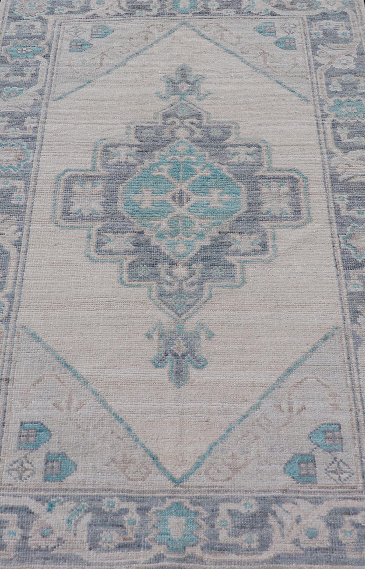 Modern Oushak with Off White Background with A Large Tribal Medallion in Teal. Measures: 3'1 x 5'3 This Oushak featuring a center tribal medallion in the center of off white background and the light gray border also. Colors are gray, cre... - Keivan Woven ArtsAWR - 10719 - 21541Rug