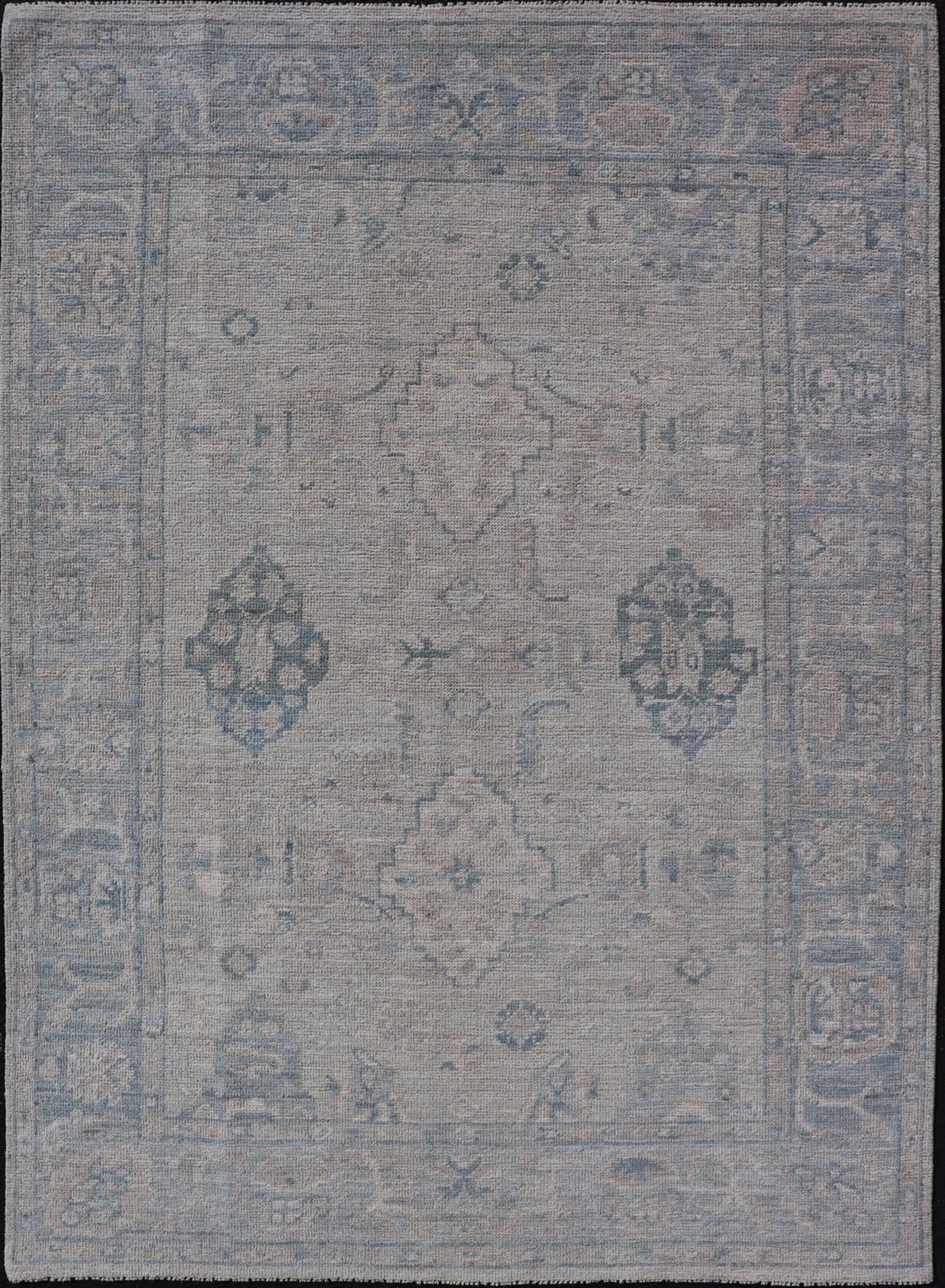 Hand - Knotted Oushak with A Light Blue Background and Tribal Motifs. Keivan Woven Arts; rug AWR - 10729 Country of Origin: Afghanistan Type: Oushak Design: Floral, All - Over Abstract - Tribal Measures: 4'0 x 5'4 This Oushak presents centered motif di... - Keivan Woven ArtsAWR - 10729 - 21627Rug