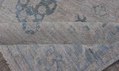 Hand - Knotted Oushak with A Light Blue Background and Tribal Motifs. Keivan Woven Arts; rug AWR - 10729 Country of Origin: Afghanistan Type: Oushak Design: Floral, All - Over Abstract - Tribal Measures: 4'0 x 5'4 This Oushak presents centered motif di... - Keivan Woven ArtsAWR - 10729 - 21627Rug