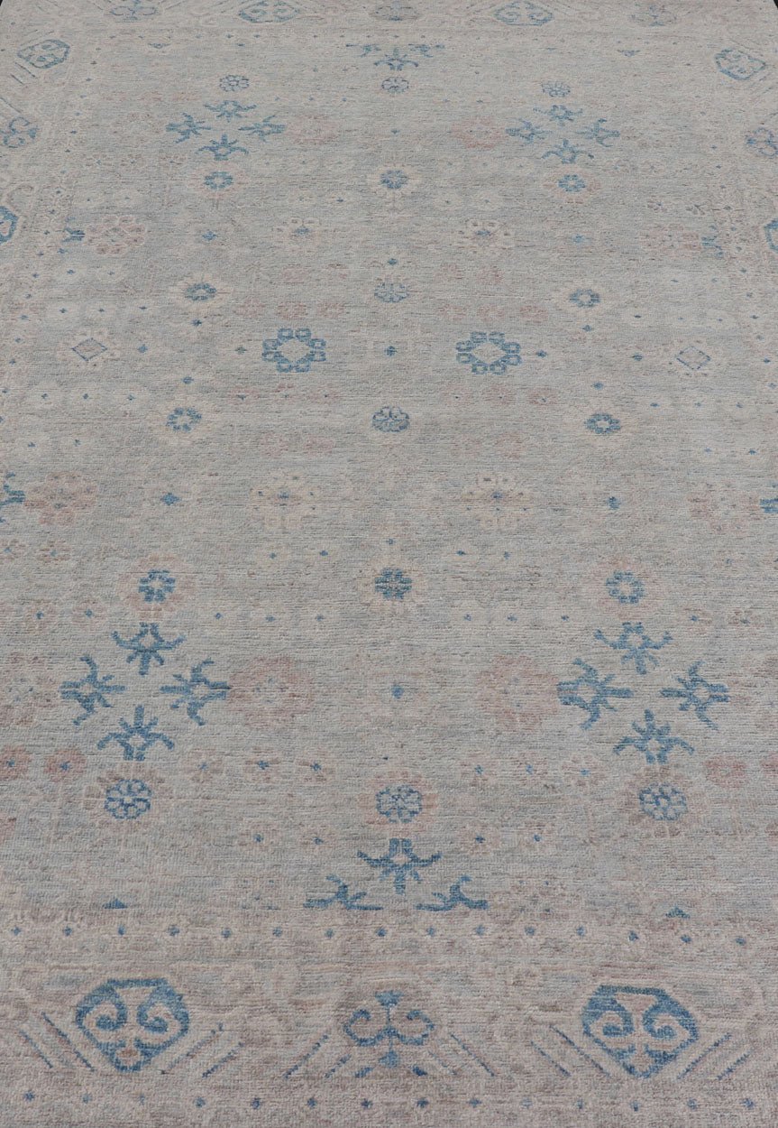 Measures: 6'4 x 9'11 Modern All - Over Khotan design rug with Light Background and Blue Colors. Keivan Woven Arts rug AWR - 12122 Country of Origin: Afghanistan Type: Oushak Design: Floral, All - Over, Abstract Floral. This Oushak was hand - knotted... - Keivan Woven ArtsAWR - 12122 - 23199Rug