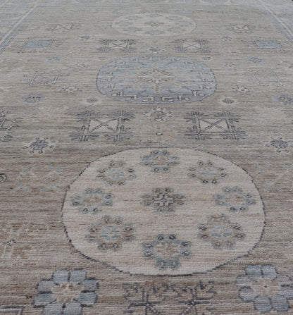 Measures: 6'0 x 9'1 Khotan Design Rug with Circular Medallion in Light Green, Light Blue, and Cream. Keivan Woven Arts , rug/AWR - 12172 country of origin / type: Afghanistan / Khotan. This Khotan features a geometric all - over design flanked b... - Keivan Woven ArtsAWR - 12172 - 23217