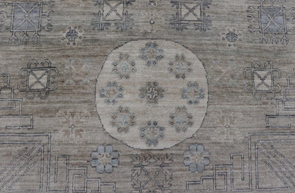 Measures: 6'0 x 9'1 Khotan Design Rug with Circular Medallion in Light Green, Light Blue, and Cream. Keivan Woven Arts , rug/AWR - 12172 country of origin / type: Afghanistan / Khotan. This Khotan features a geometric all - over design flanked b... - Keivan Woven ArtsAWR - 12172 - 23217