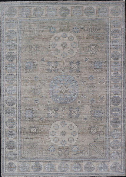 Measures: 6'0 x 9'1 Khotan Design Rug with Circular Medallion in Light Green, Light Blue, and Cream. Keivan Woven Arts , rug/AWR - 12172 country of origin / type: Afghanistan / Khotan. This Khotan features a geometric all - over design flanked b... - Keivan Woven ArtsAWR - 12172 - 23217