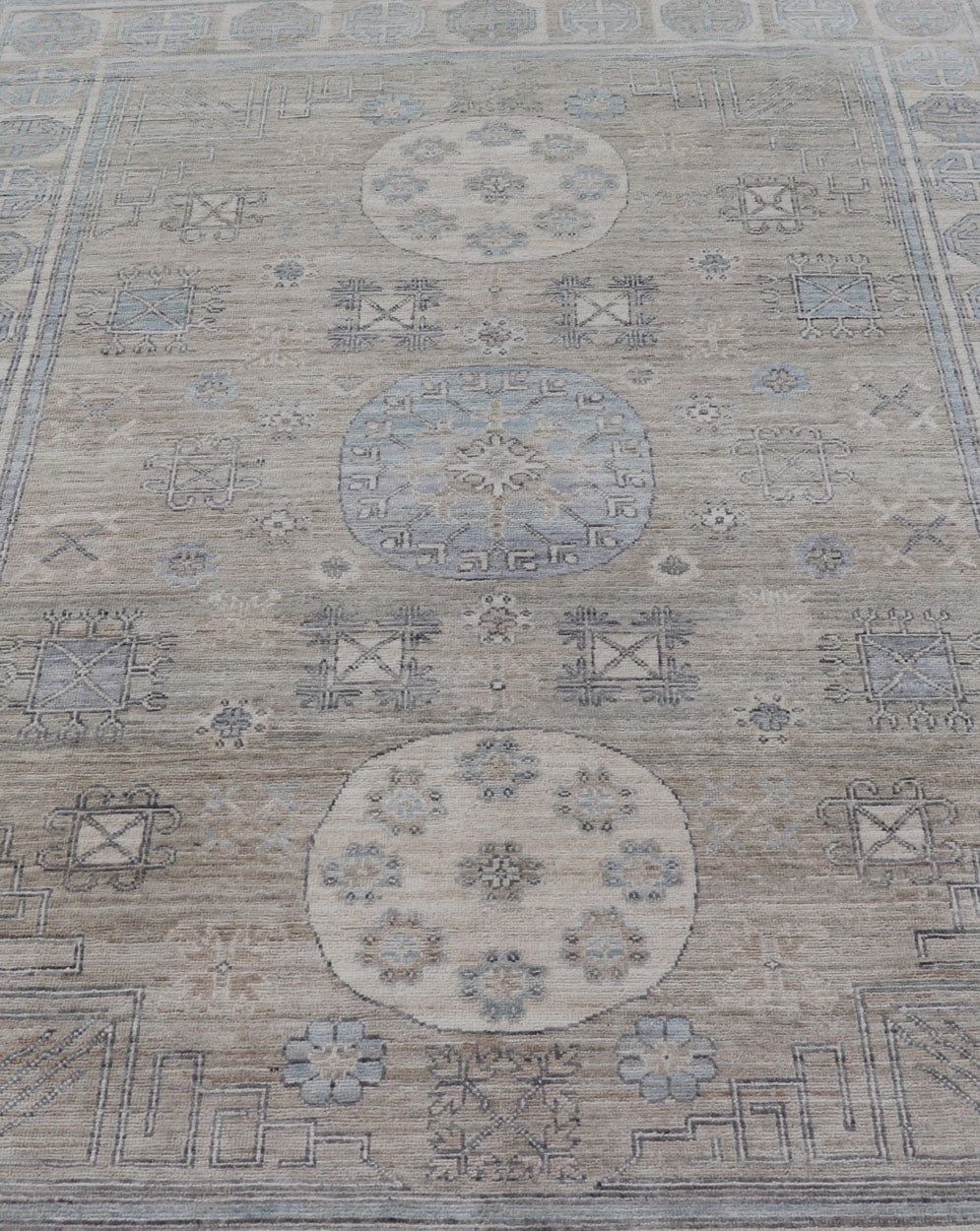 Measures: 6'0 x 9'1 Khotan Design Rug with Circular Medallion in Light Green, Light Blue, and Cream. Keivan Woven Arts , rug/AWR - 12172 country of origin / type: Afghanistan / Khotan. This Khotan features a geometric all - over design flanked b... - Keivan Woven ArtsAWR - 12172 - 23217